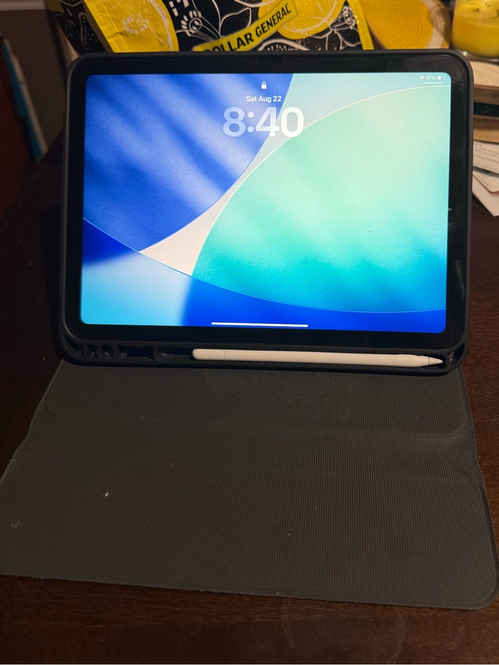 Yellow Apple iPad 10th Generation With Black Protective Case and White Stylus